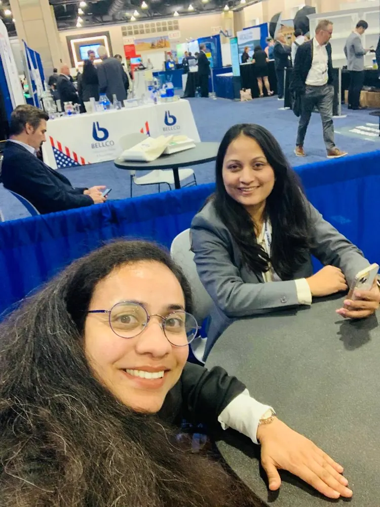 Colleagues seated together at a conference networking table