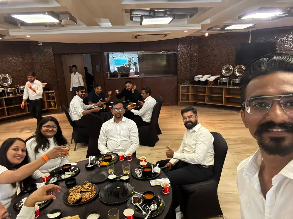 The team gathered together in the office for a group photo