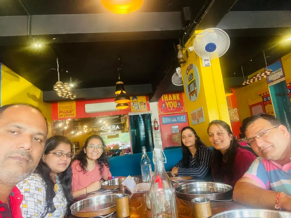 Colleagues sharing a meal together at a restaurant